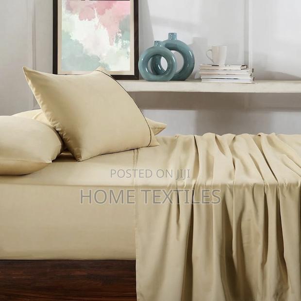 2 Beige Bedsheets and 4 Pillowcases · Photo 1
