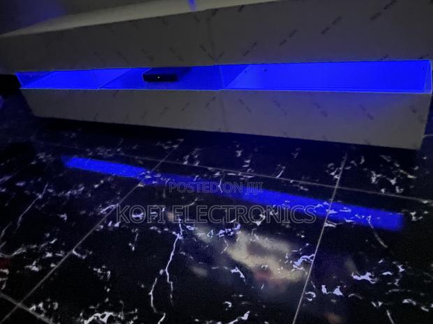An Affordable High Gloss Tv Stand in White With Led Lighting · Photo 1
