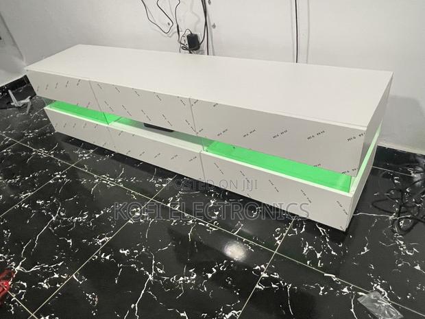 An Affordable High Gloss Tv Stand in White With Led Lighting · Photo 2