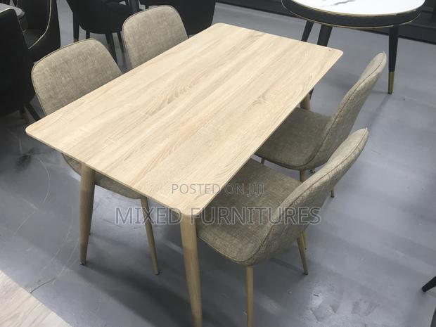 Quality Wooden Dining Table With Material Chairs · Photo 2
