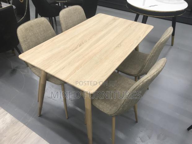 Quality Wooden Dining Table With Material Chairs · Photo 1