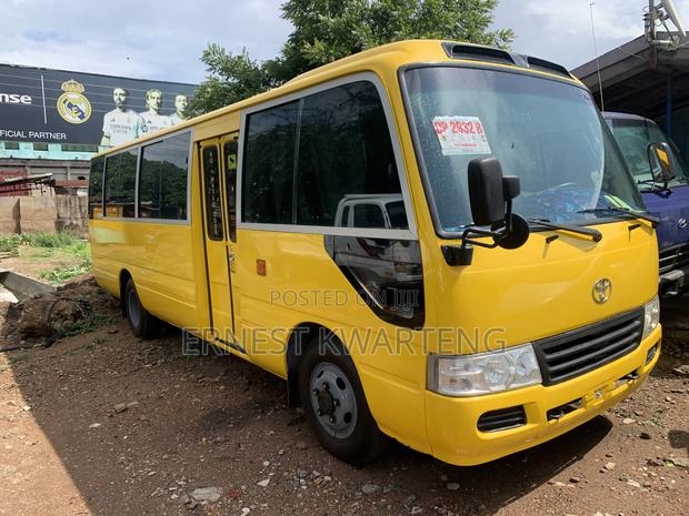 Toyota Coaster 2014 Yellow · Photo 4