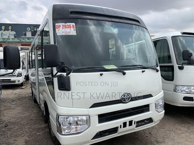 Toyota Coaster 2019 White · Photo 1