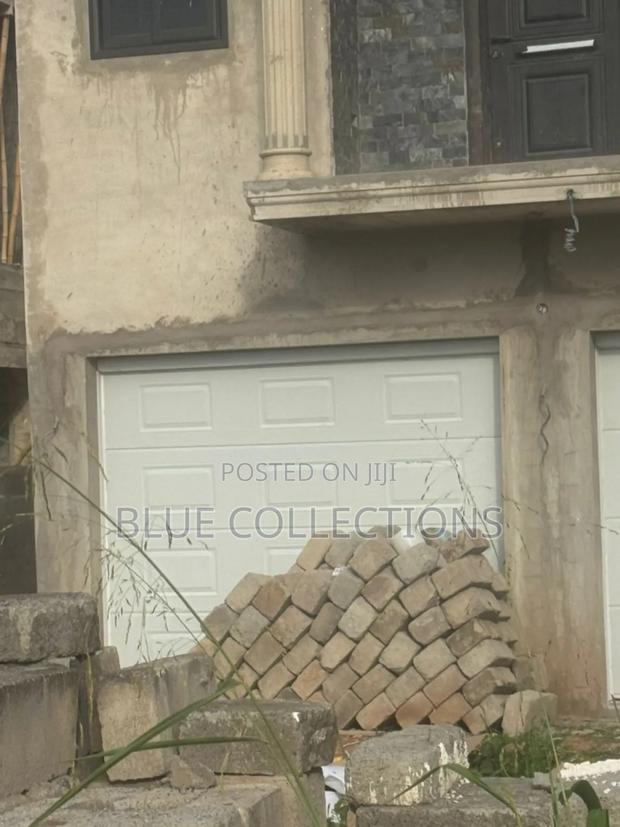 Double Automated Garage Door · Photo 1