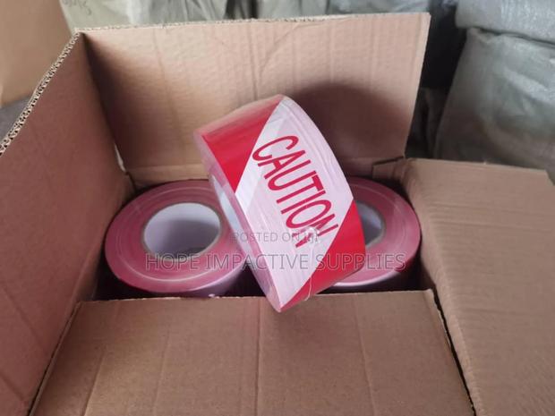 Caution Tape - Red & White - With Caution Label Inside. · Photo 1