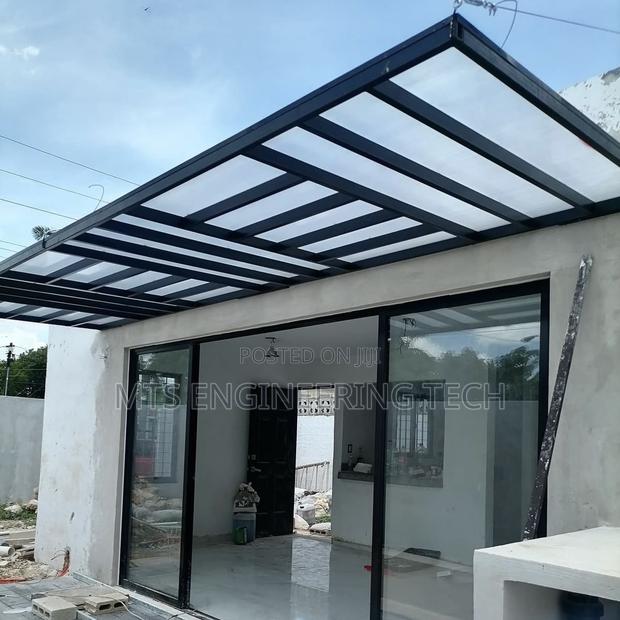 Modern Metal Shades With Polycarbonate Roofing · Photo 6
