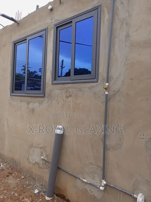 Grey Italian Sliding Windows Well Installed · Photo 1