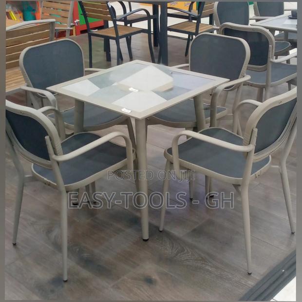 Outdoor Dining Set Chairs and a Metal Square Table · Photo 2