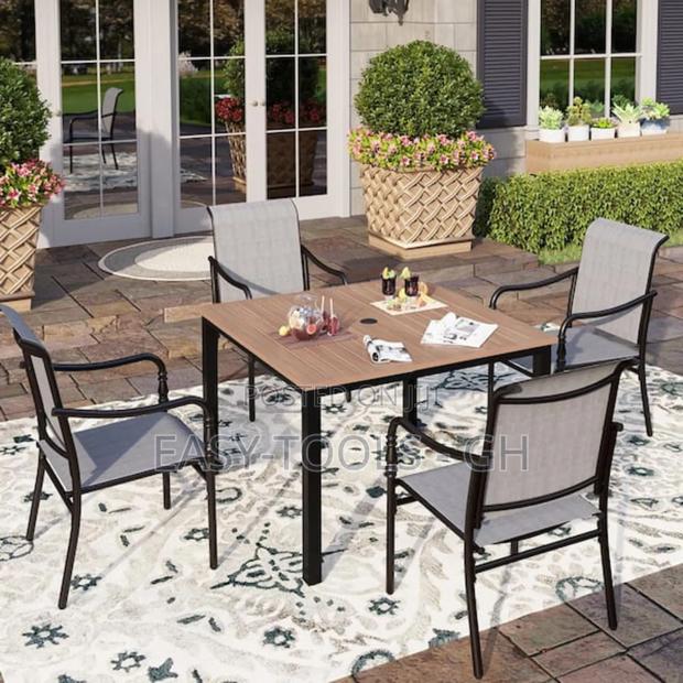 Outdoor Dining Set Chairs and a Metal Square Table · Photo 1