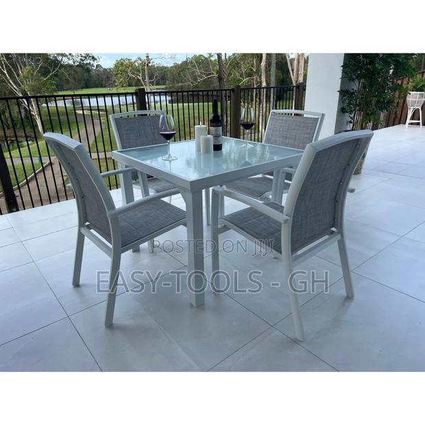 Outdoor Dining Set Chairs and a Metal Square Table · Photo 5