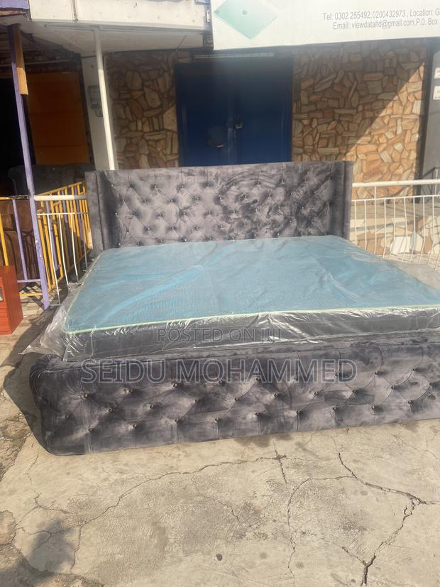 A King Bed Frame With Mattress · Photo 1