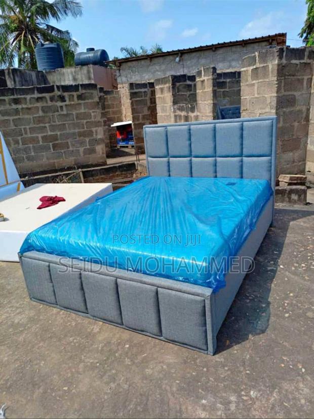 A Design Bed Frame With Mattress · Photo 1