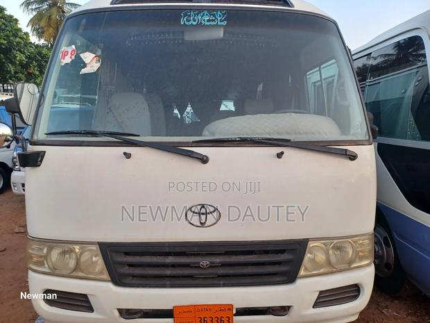 Toyota Coaster 2013 White · Photo 2