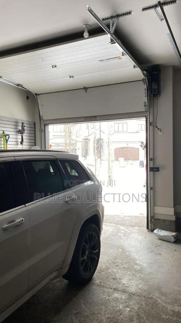Smart Garage Door With Fanlight · Photo 2