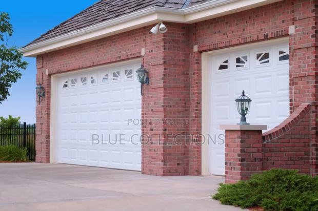 Garage Doors With Fanlight · Photo 1