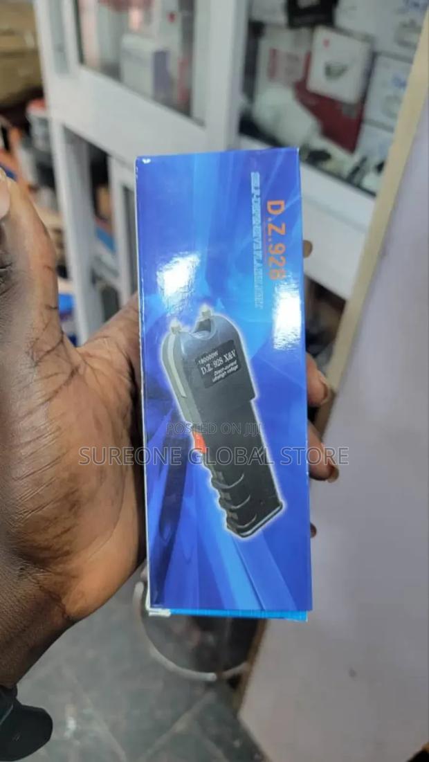 Stun and Shecker With Bright Tactical Flashlight Light · Photo 2