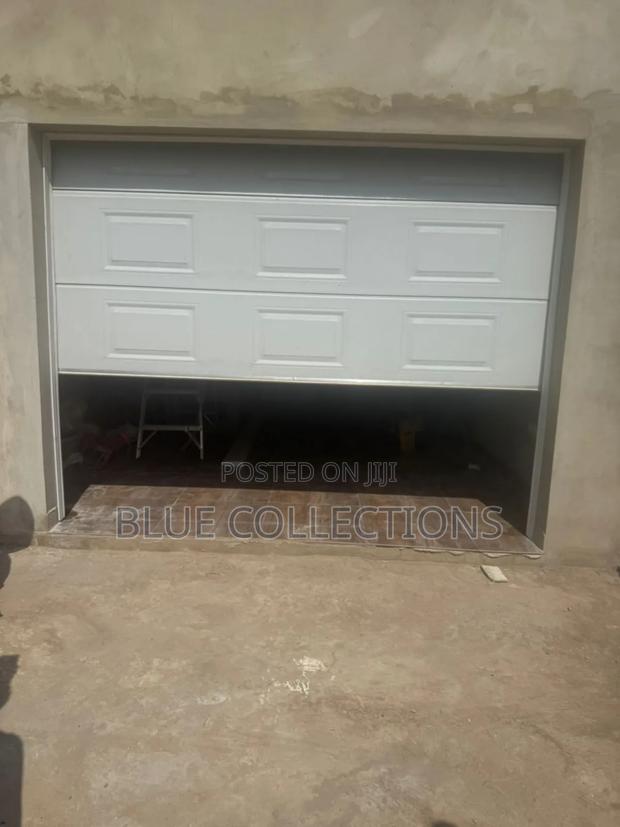 Garage Door With Motor and Remote · Photo 1