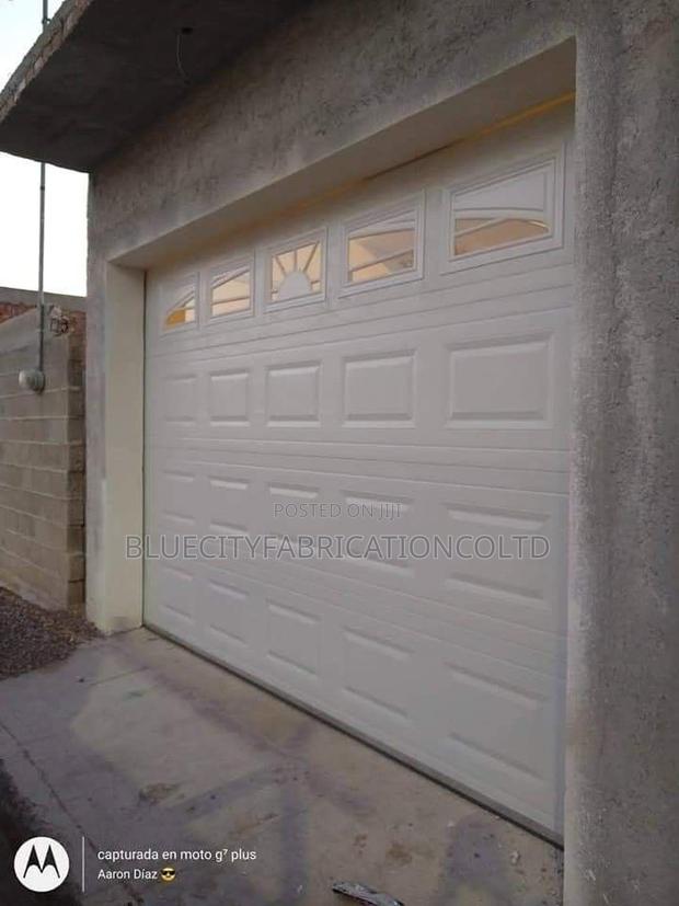 Aaa Plus Imported Automated Garage Door System With Remote · Photo 1