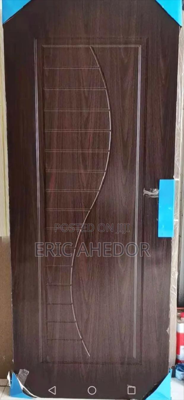 Wooden Metal Security Door With Metal Frames and Handles · Photo 1