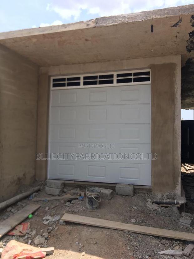 Automated Garage Door With Fanlight · Photo 1