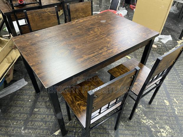 Wooden Dining Table With Four Chairs Available in Stock · Photo 1