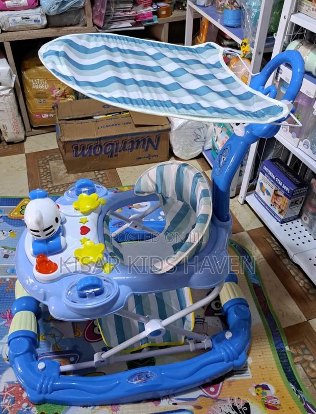 Fashion Baby Walker With Music, Foot Mat, and Umbrella · Photo 1