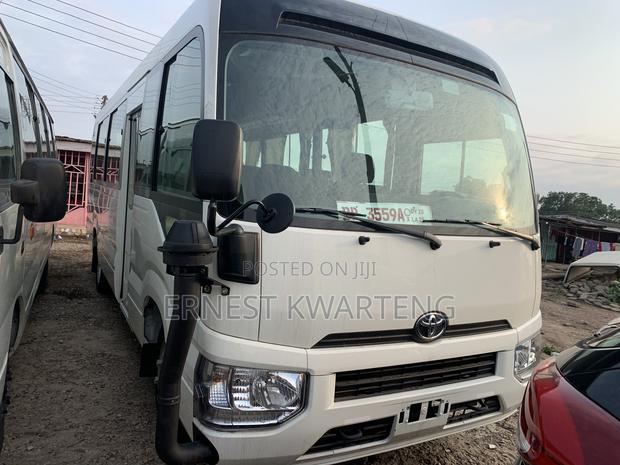 New Toyota Coaster 2024 White · Photo 2