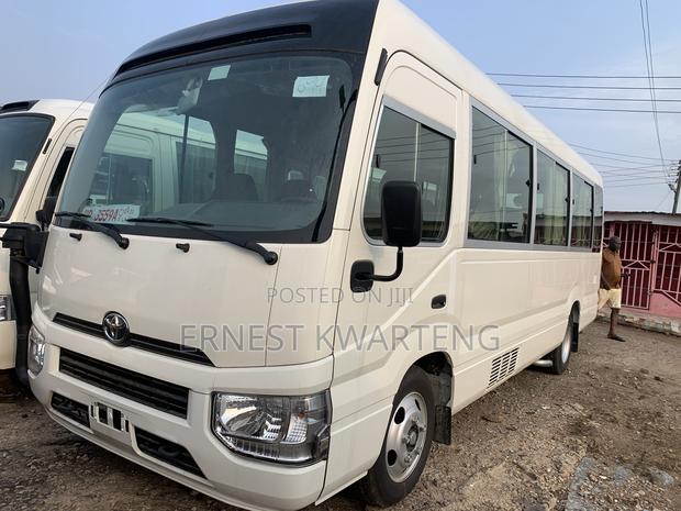 New Toyota Coaster 2024 White · Photo 1