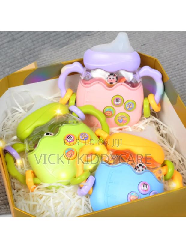Interactive Musical Electric Rattle Silicone Feeding Bottle · Photo 1