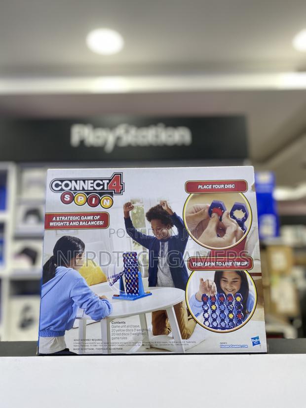 Hasbro Gaming Connect 4 Spin Game, Features Spinning · Photo 1