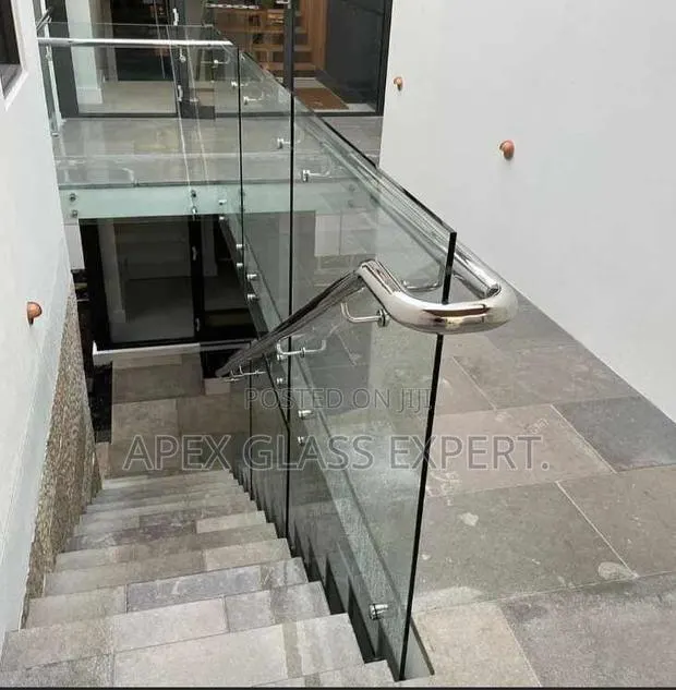 Staircase Glass With Stainless Railing Support · Photo 1