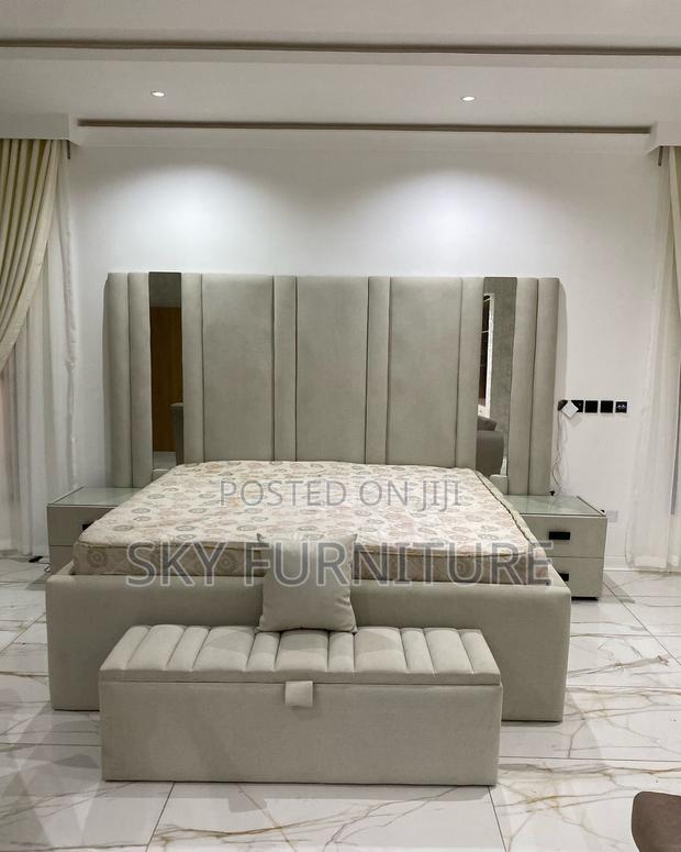 Whispers King-Size Bed Frame With Side Drawers and Ottoman · Photo 1
