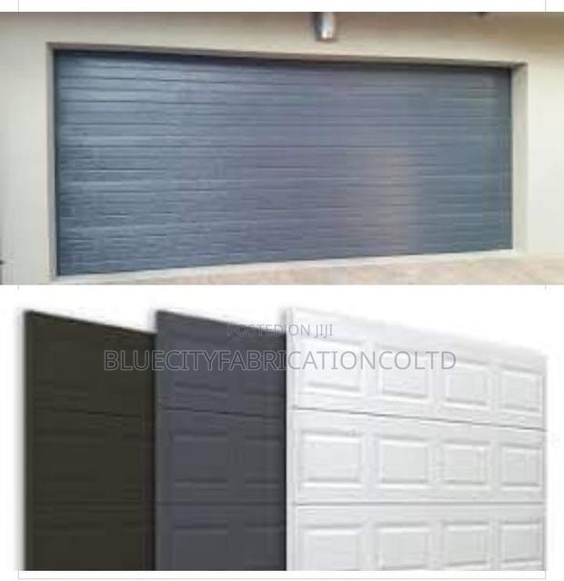 Automatic Garage Door Sectional With Motor and Two Remote · Photo 1