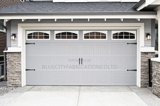 Canadian Automated Garage Door With Two Remote · Photo 1