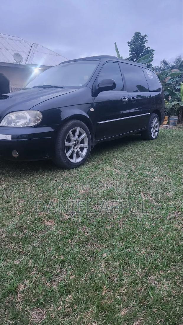 Kia Combi 2006 Black · Photo 2