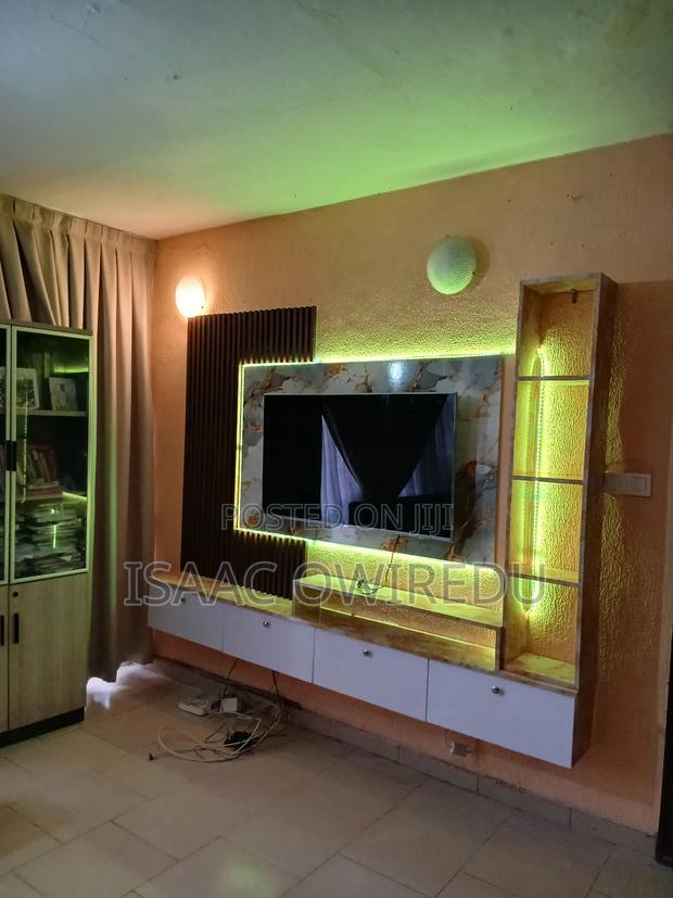 Television Wall Mounted Design With Panel And Lighting System · Photo 1