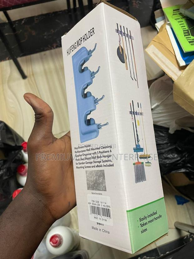 Multipurpose Wall Mounted Mop Broom Holder · Photo 3