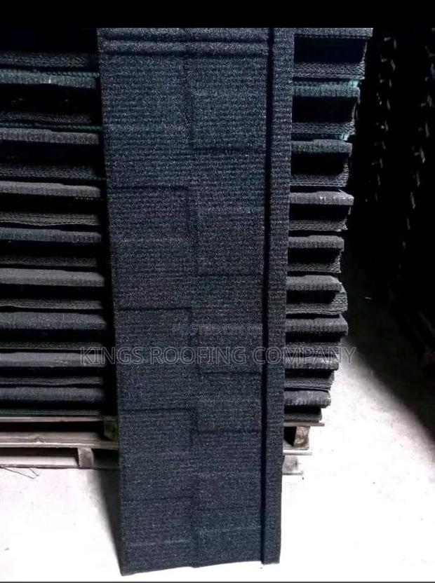 Packed Black Shingle Roofing · Photo 1