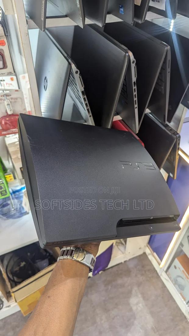 A Black Playstation 3 Slim With Games for Sale in Accra · Photo 3