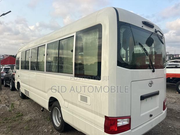 New Toyota Coaster 2024 White · Photo 4