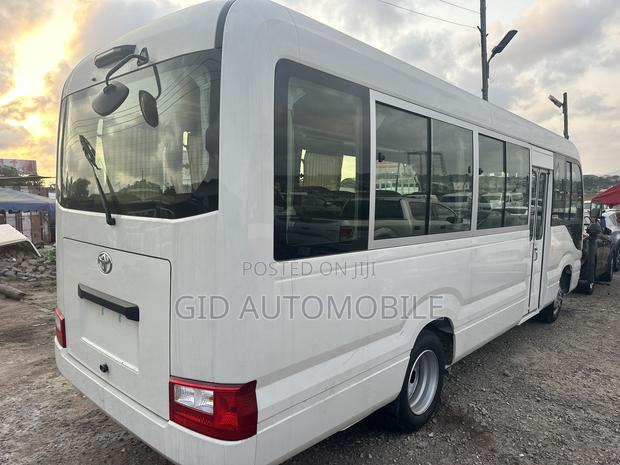 New Toyota Coaster 2024 White · Photo 2
