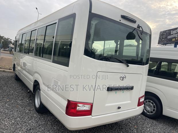 New Toyota Coaster 2025 White · Photo 2
