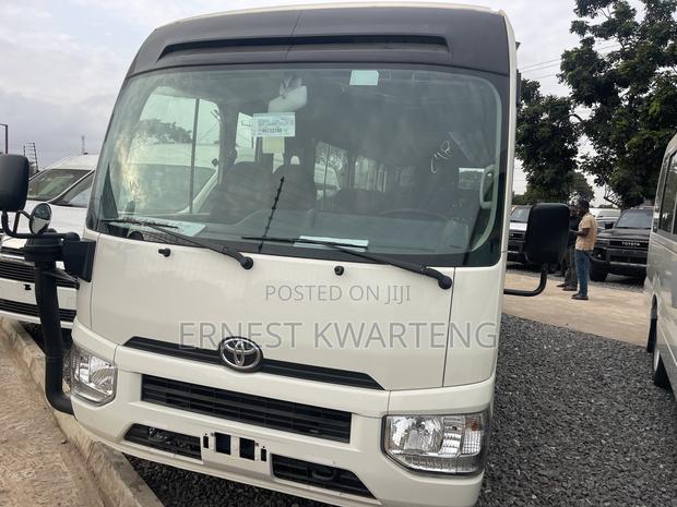 New Toyota Coaster 2025 White · Photo 1