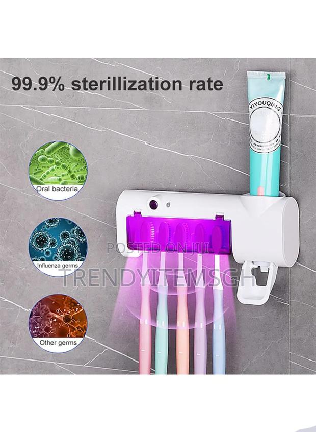 Electric Toothbrush Holder Uv Sterilizer With Toothpaste Dispenser · Photo 1
