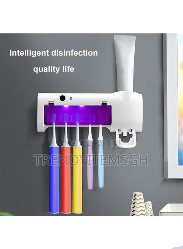Electric Toothbrush Holder Uv Sterilizer With Toothpaste Dispenser · Photo 2