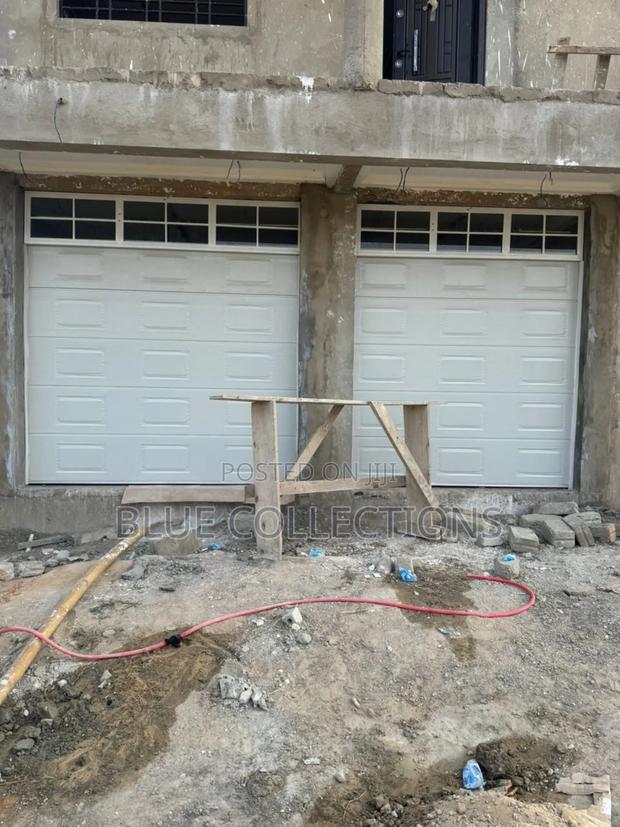Solar Automated Garage Door · Photo 1