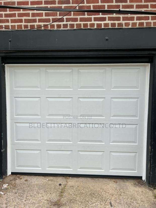 Garage Door Sale Repair and Installation · Photo 1