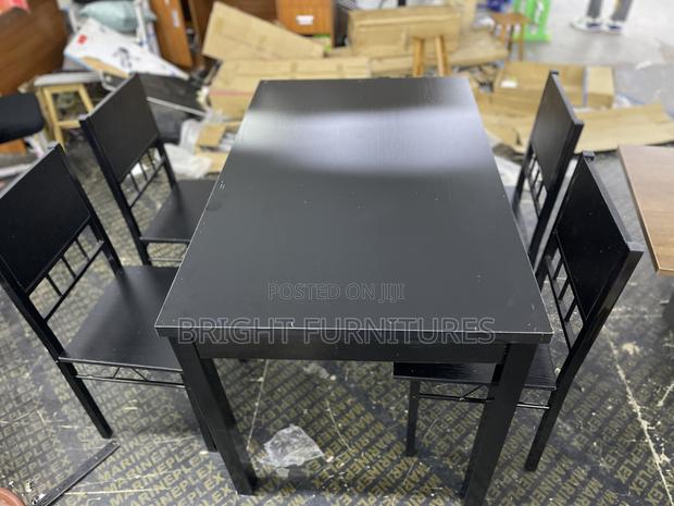 Table With 4 Seats ( Wooden and Black in Color) · Photo 2