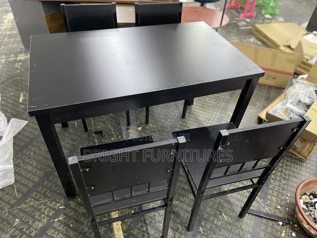 Table With 4 Seats ( Wooden and Black in Color) · Photo 3