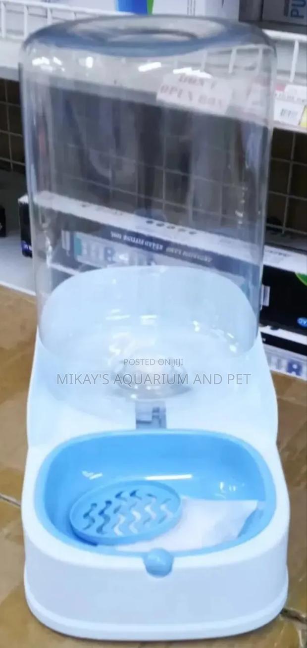 Plastic Bottle Feeder for Dogs · Photo 1